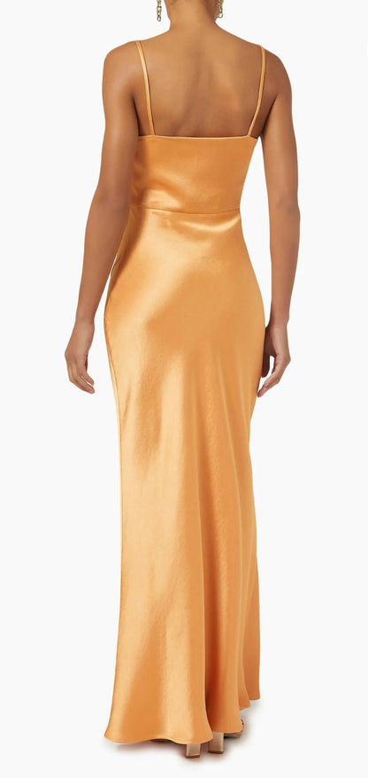 Bec & Bridge Maxi Dress in Tangerine, back view against a white background. 